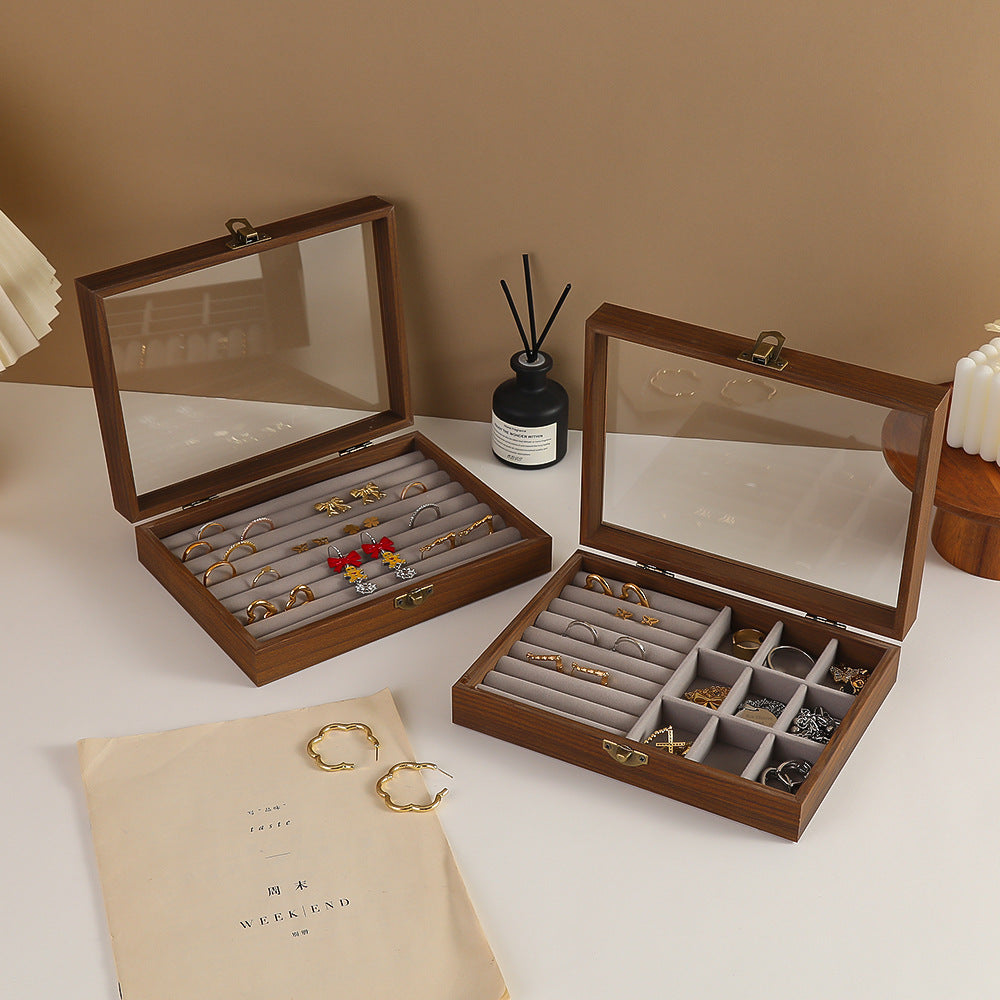 Gray ring cushion jewelry box at three-quarter angle with transparent window and gray wood finish