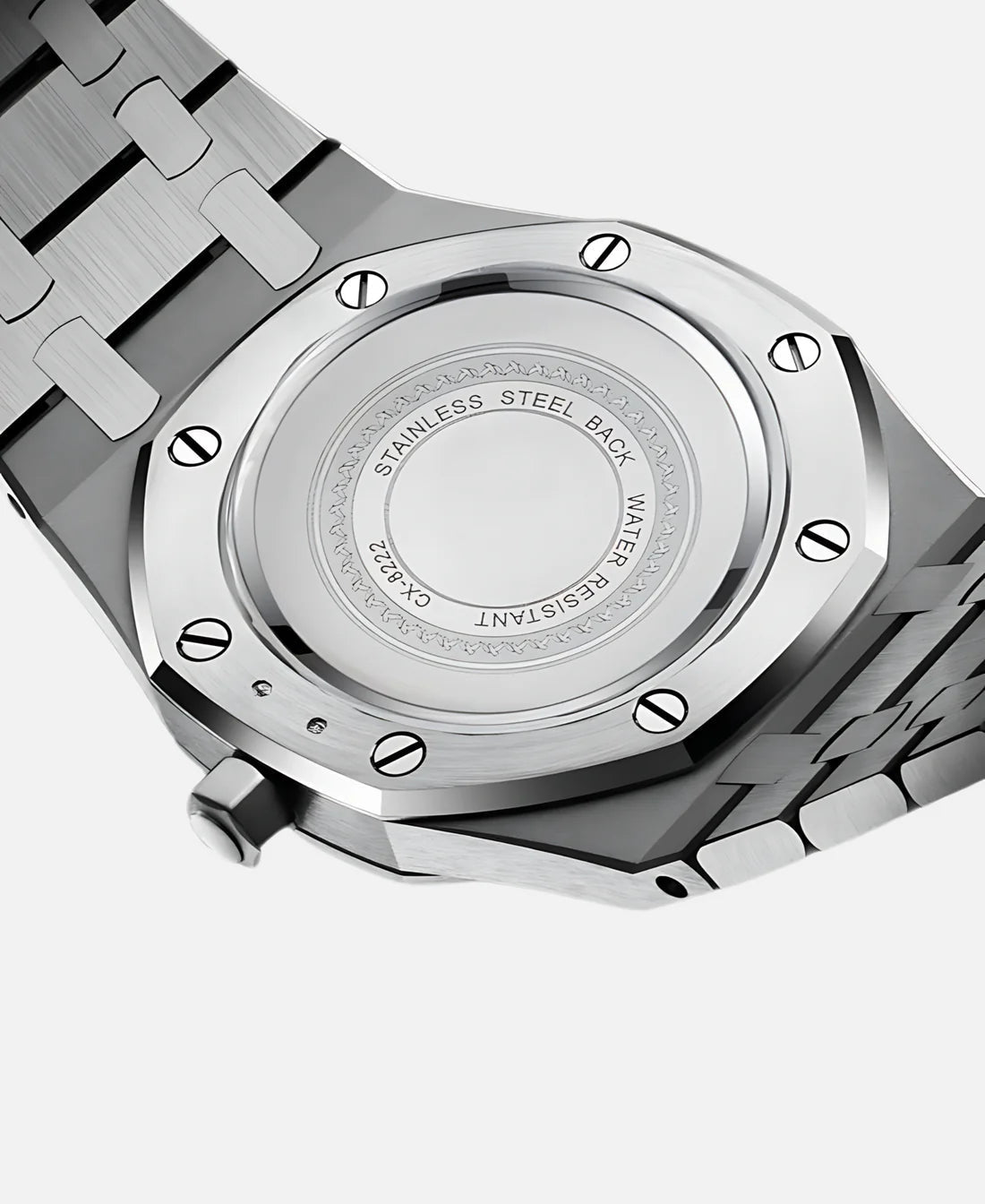 A very close-up shot of the Kings Oak Chronograph Men's Watch's stainless steel case back, clearly showing the engraved text 'STAINLESS STEEL BACK', 'WATER RESISTANT', and 'CX.822' around the central polished area. The screws securing the case back are also visible.