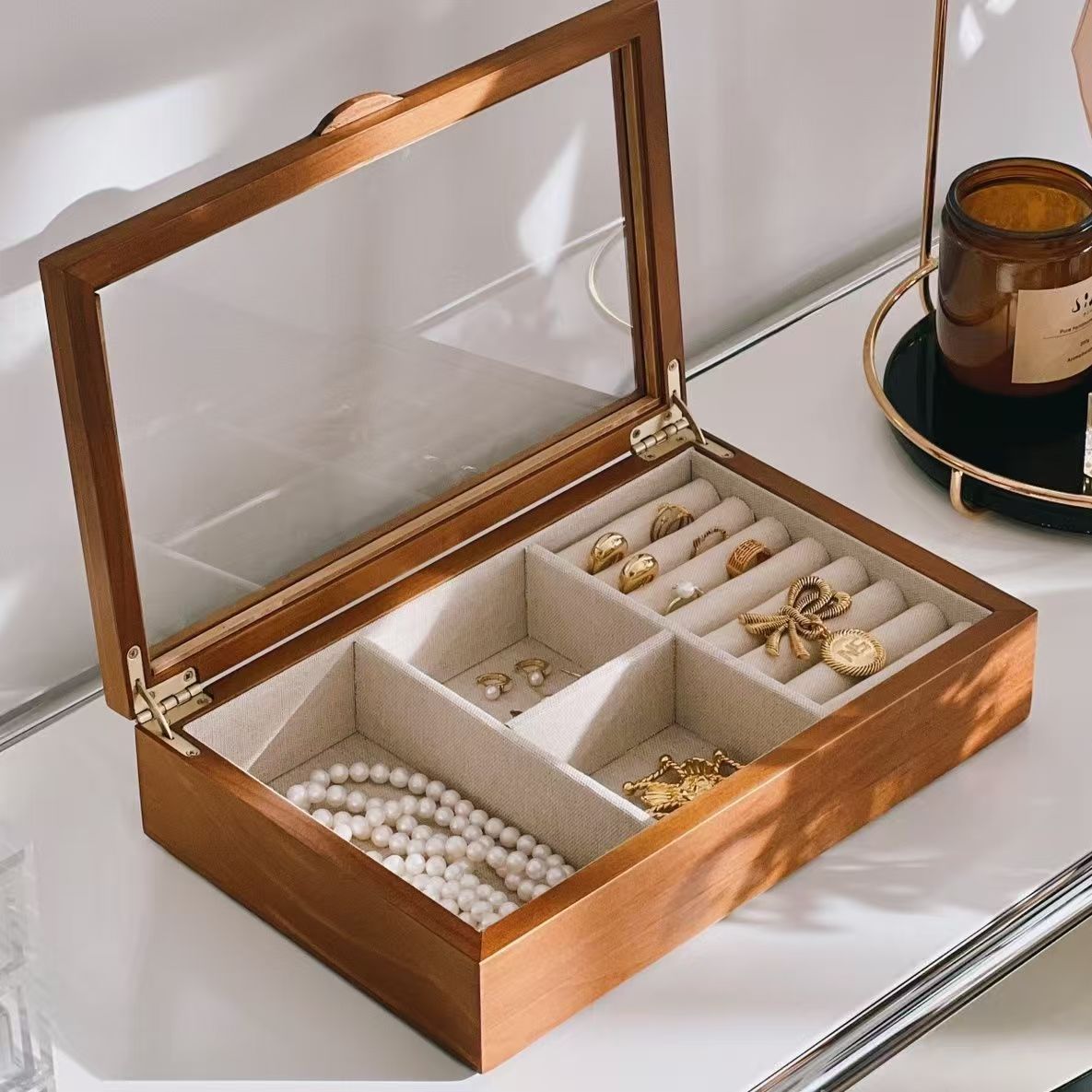Front view of pine octagonal jewelry box with glass lid in ambient room lighting
