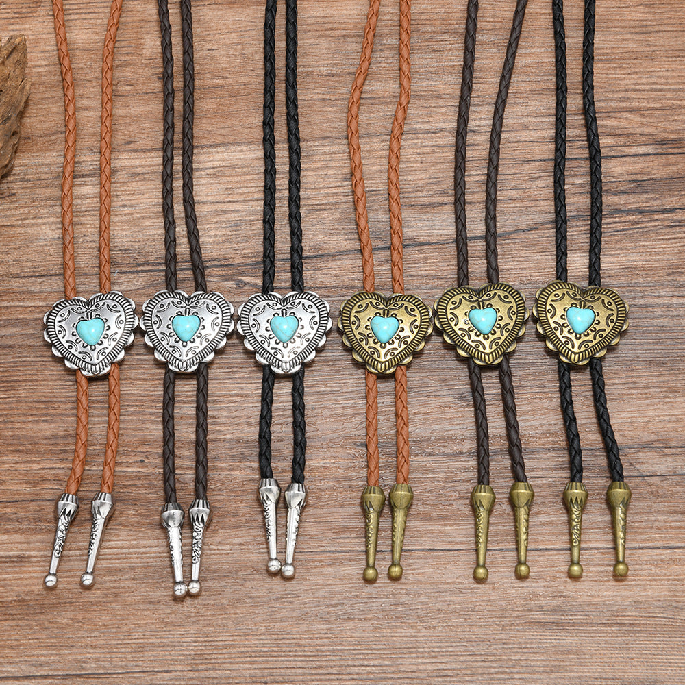 Front view of turquoise heart zinc alloy pendant with braided deep coffee leather in vintage rococo style with antique bronze finish