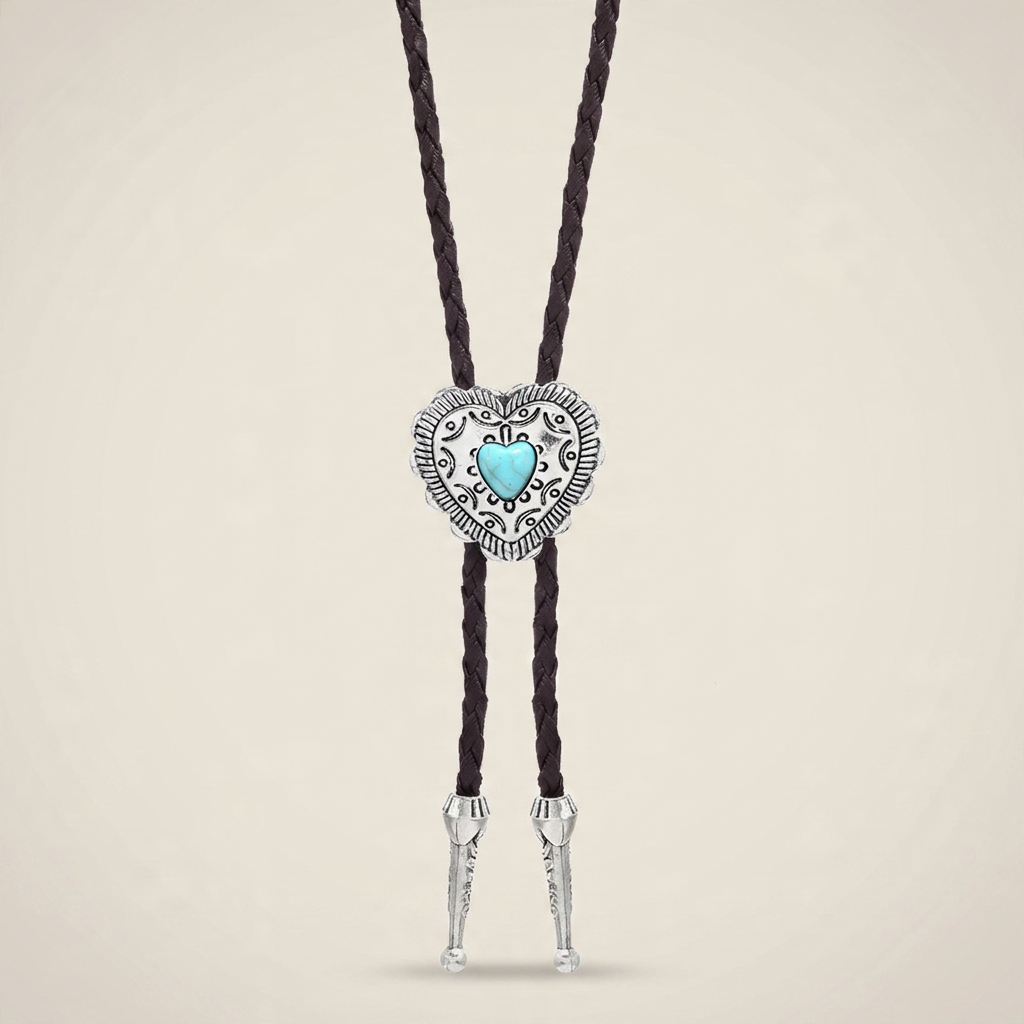 Three-quarter close-up of turquoise heart pendant with braided light coffee leather and antique bronze finish