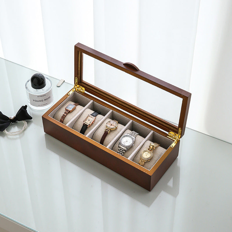 Front view of watch octagonal jewelry storage box in oak tone with glass lid