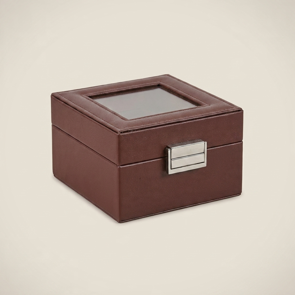 Front view of black PU leather six-position watch box with metal clasp securing closed lid