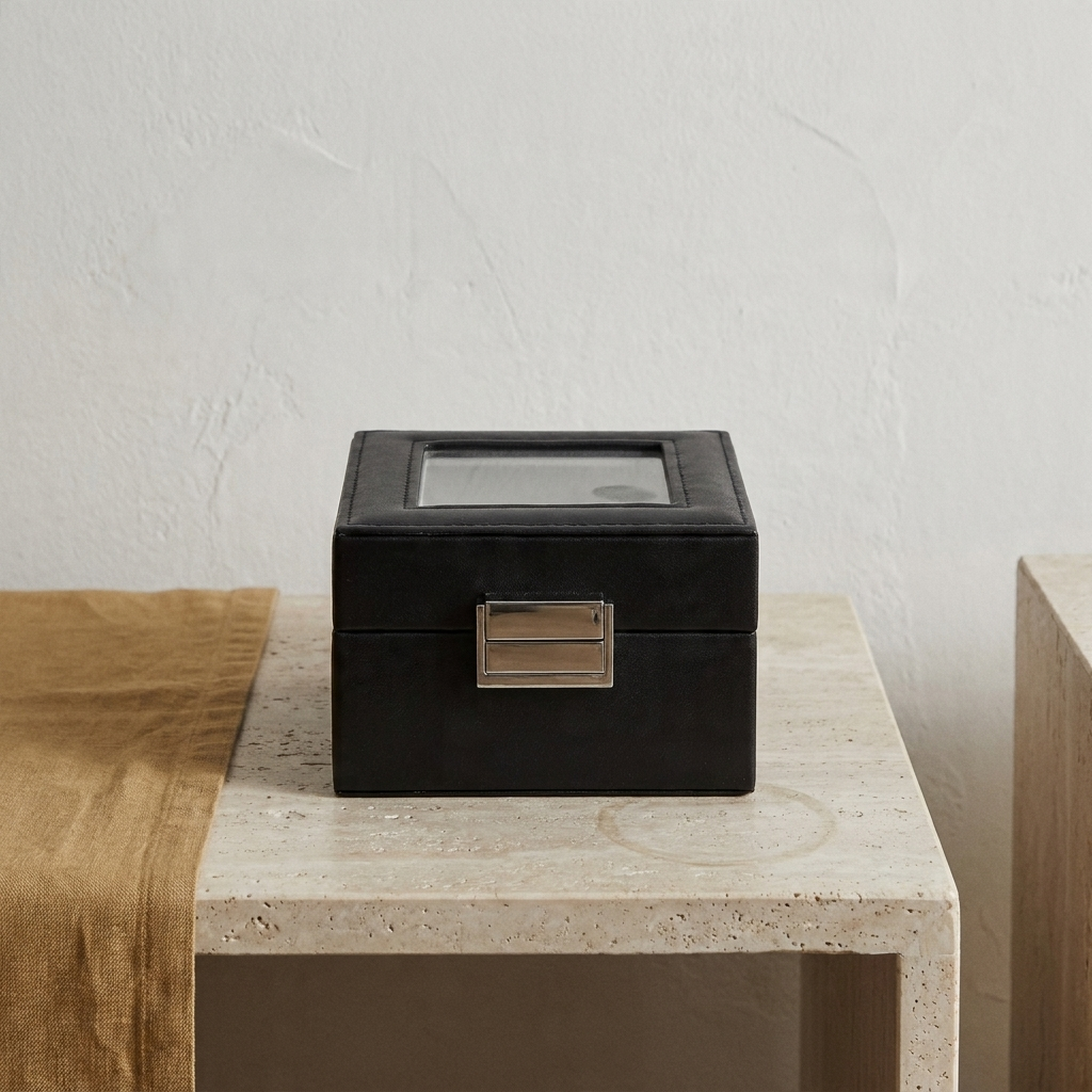 Black PU leather six-position single-layer watch box at three-quarter angle with lid open showing gray fabric interior compartments