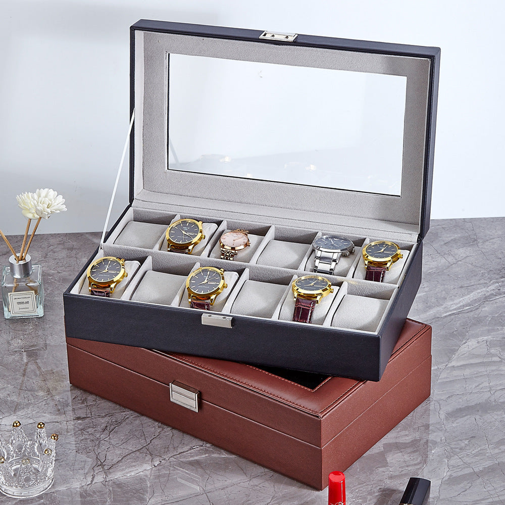 Top-down view of black PU leather six-position watch box with closed lid and visible gray fabric compartments inside