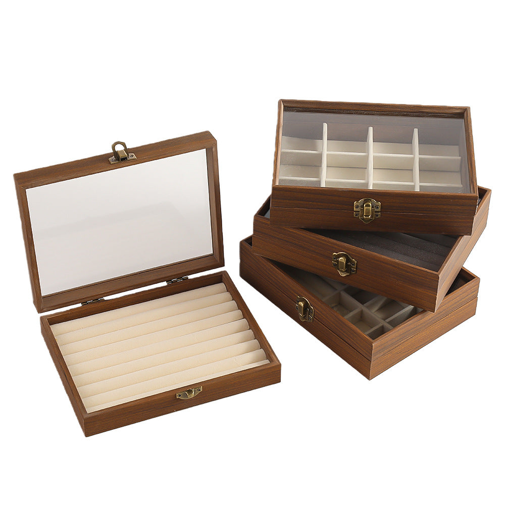 Gray ring cushion jewelry box top-down view with transparent window showing gray wood and ring cushion layout