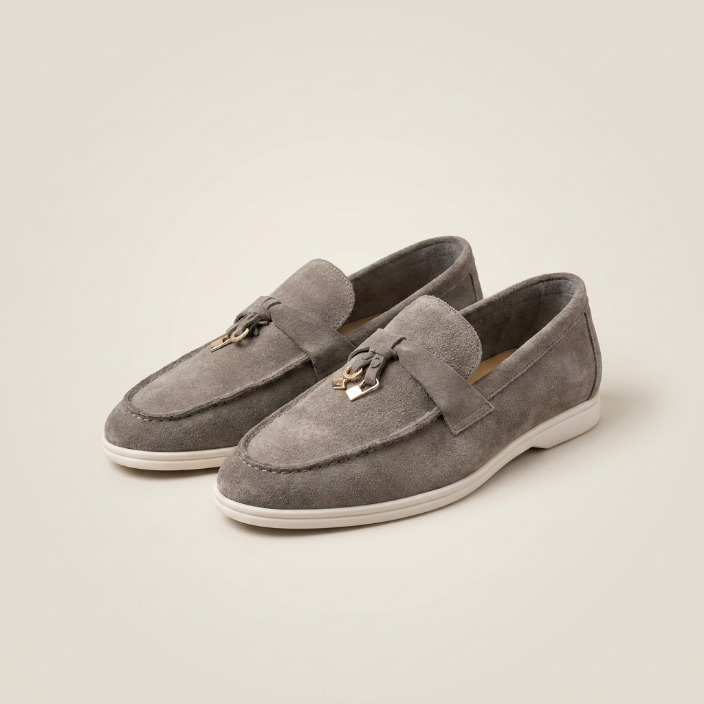 Side profile of gray matte sheepskin suede loafer with low heel and round toe slip-on style