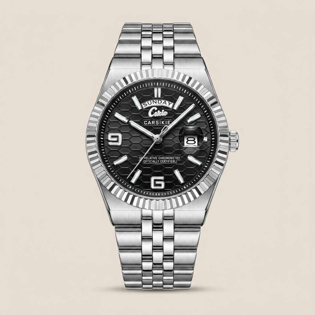 Silver stainless steel men’s watch with black dial top-down showing fluted bezel and bracelet lit