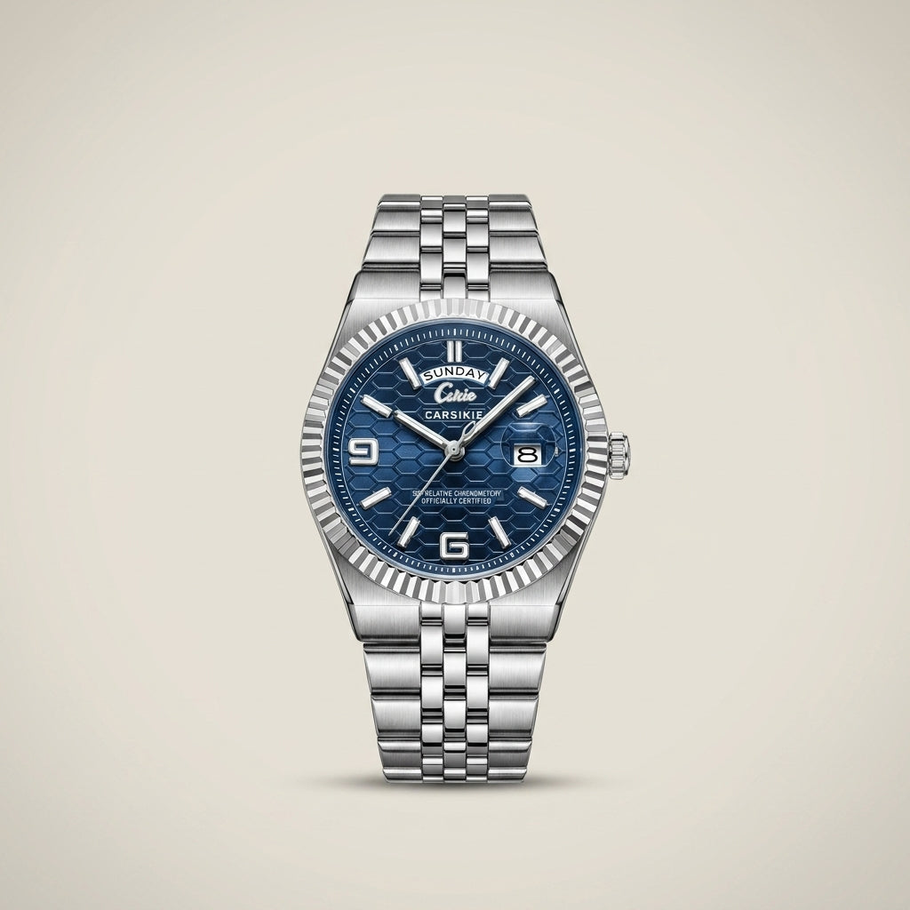 Silver stainless steel men’s watch with deep sea blue dial at three-quarter angle lit highlighting luminous hands