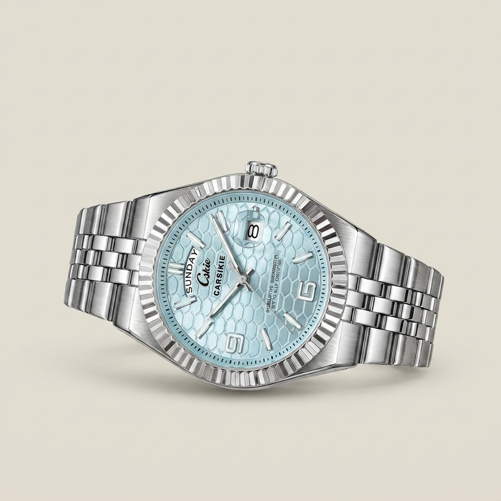 Close-up of silver stainless steel men’s watch with white dial showing date calendar and luminous hands lit
